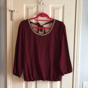 A maroon blouse